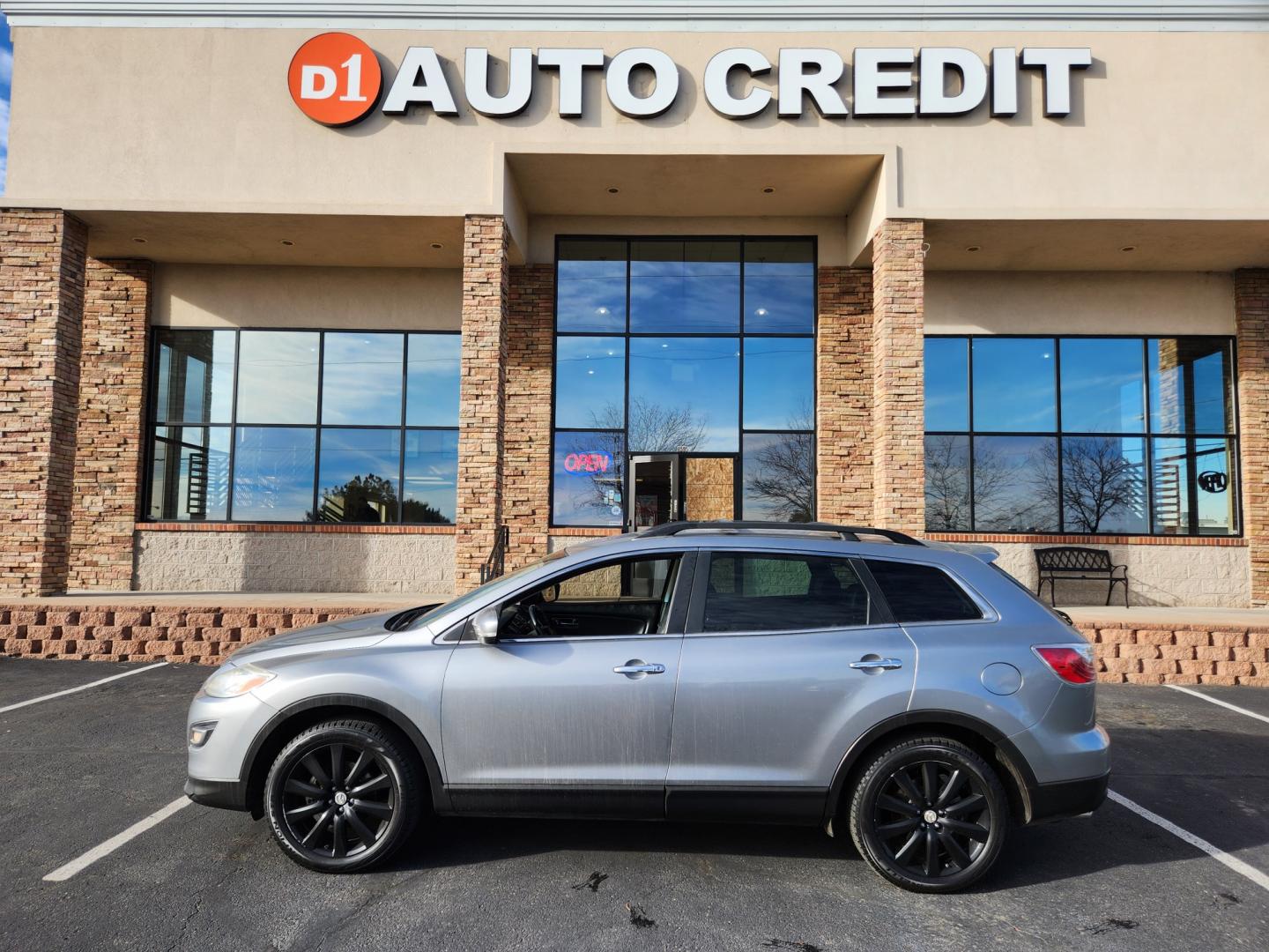 2010 Liquid Silver Metallic /Black Mazda CX-9 Grand Touring (JM3TB3MA6A0) with an 3.7L V6 DOHC 24V engine, Automatic transmission, located at 8595 Washington St., Thornton, CO, 80229, (303) 287-5511, 39.852348, -104.978447 - 2010 Mazda CX-9<br><br>D1 Auto NEVER charges dealer fees! All cars have clean titles and have been inspected for mechanical issues. We have financing for everyone. Good credit, bad credit, first time buyers.<br><br>Please call Lakewood Location 303-274-7692 or Thornton 303-287-5511 to schedule a tes - Photo#0